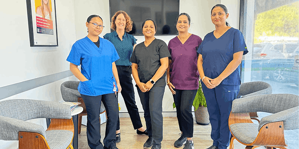 Group photo of the Sure Smile Dental team, showcasing their friendly and professional demeanor in the clinic.